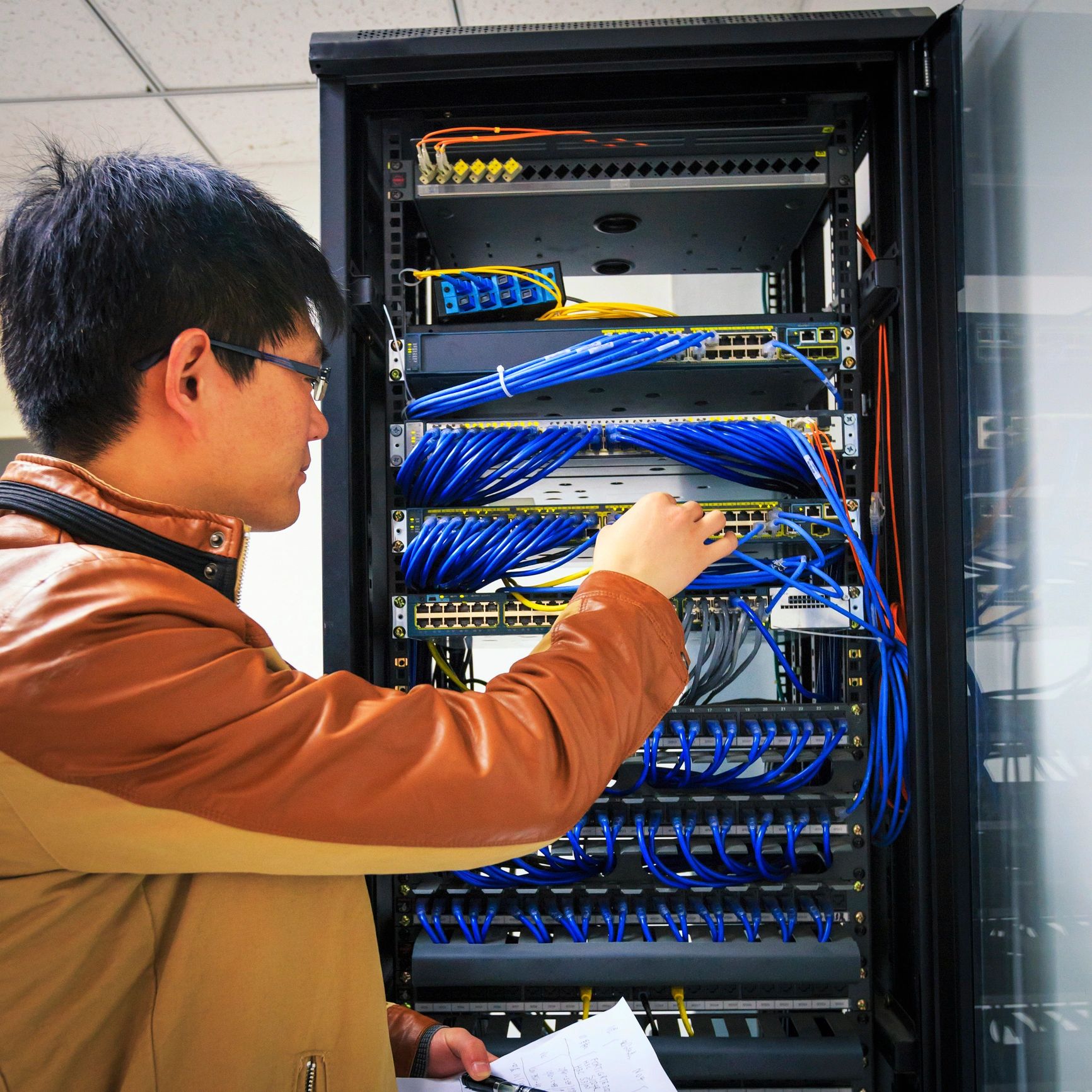 Server rack interior with blue servers