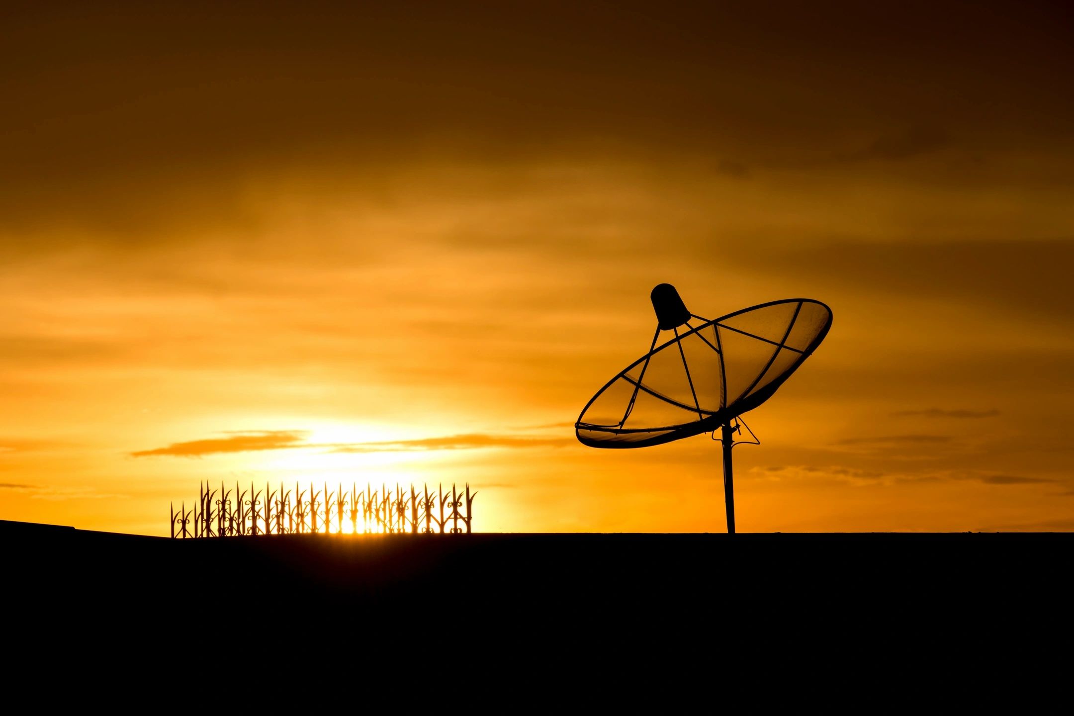 Satellite dish at sunset